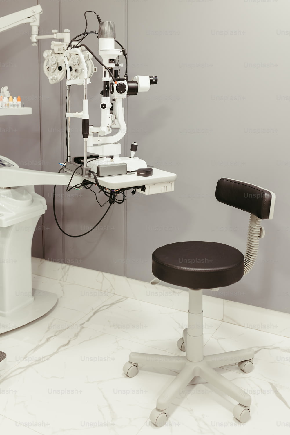 a dentist chair with a microscope on top of it
