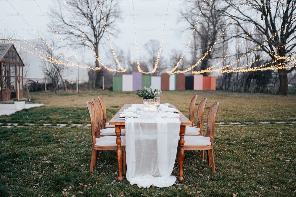 a long table with a white table cloth on it