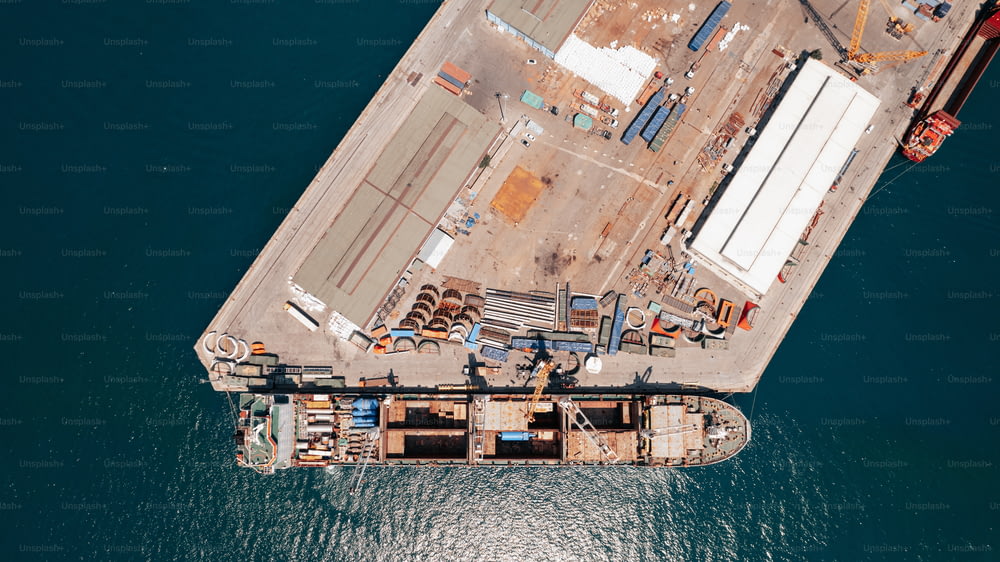 an aerial view of a cargo ship in the water