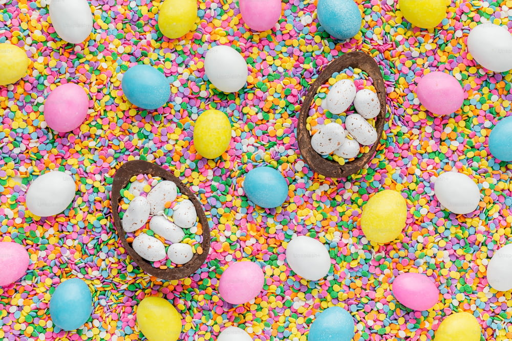 a table topped with chocolate eggs and sprinkles