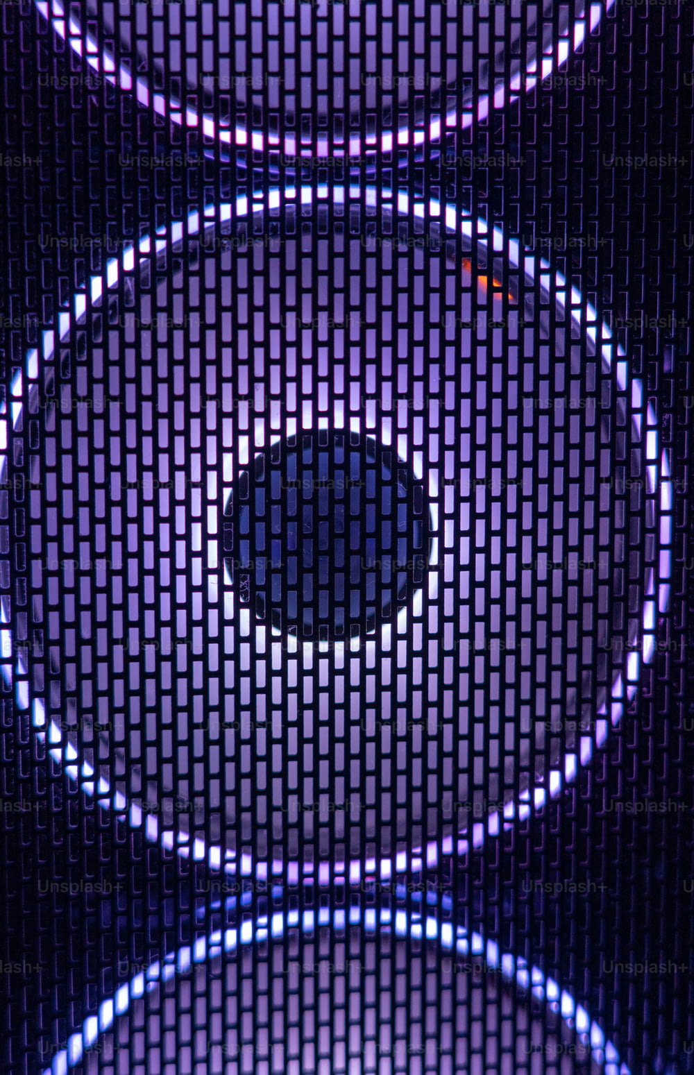a close up of a speaker with lights on it