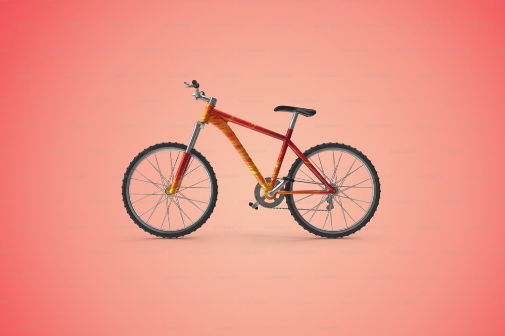 Un vélo rouge et jaune sur fond rose