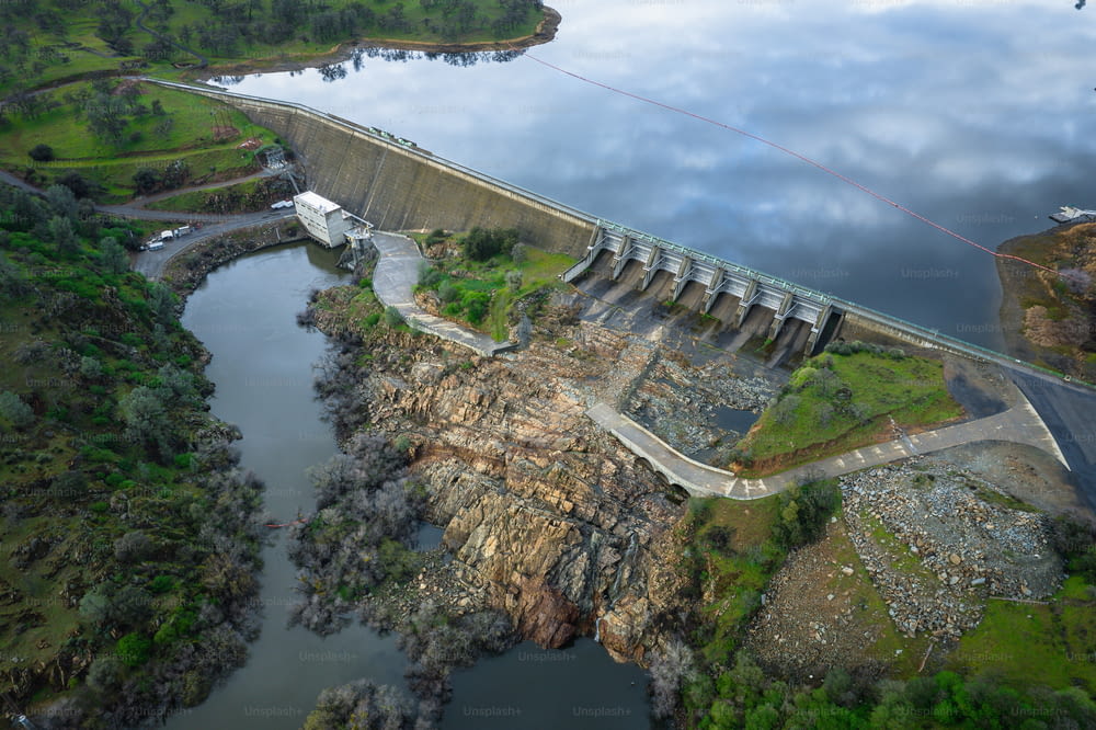 an aerial view of a dam and a body of water