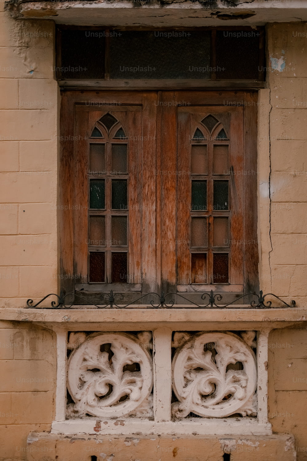 a window with a wooden frame and two windows
