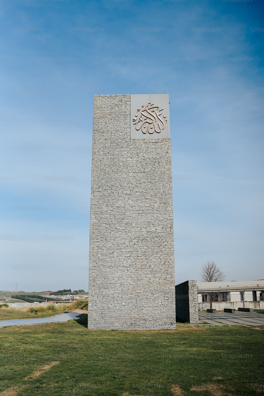 a tall monument with a sign on the side of it