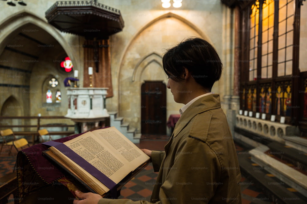 a person holding a book in a church
