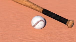 ピンク色の表面の野球のバットと野球のボール