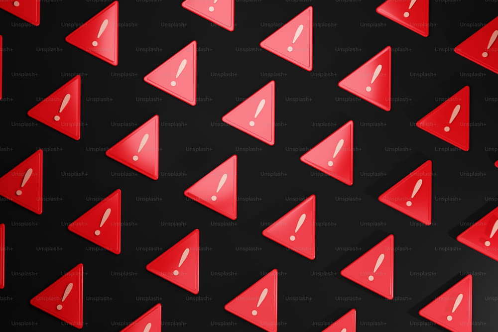Un groupe d’objets en forme de triangle rouge sur fond noir