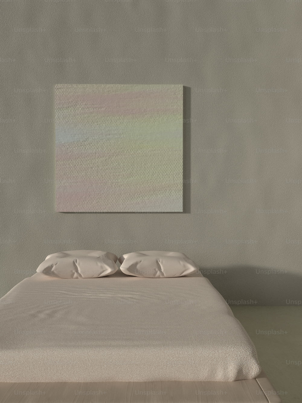 a bed in a room with a painting on the wall