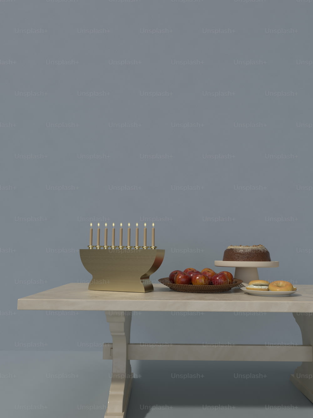 uma mesa coberta com um bolo e uma tigela de frutas