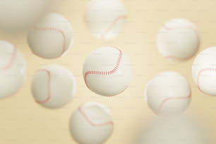 a group of white balls with a red stitch on them