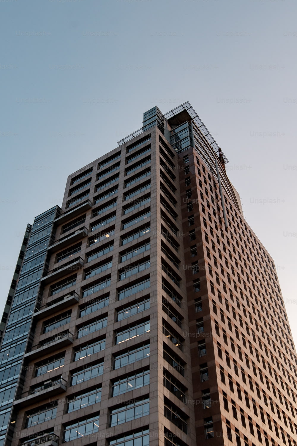a tall brown building with lots of windows