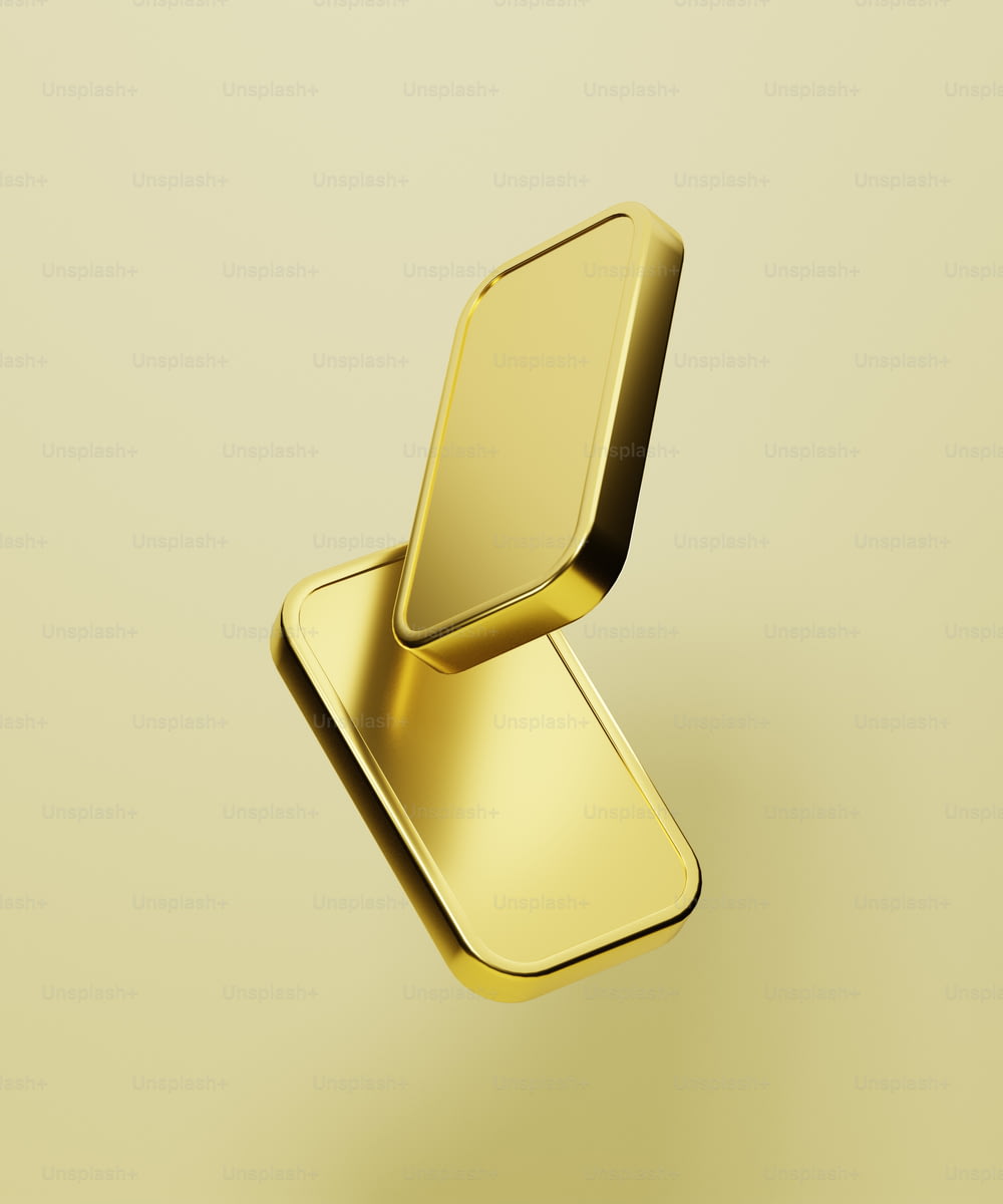 a gold metal object on a yellow background
