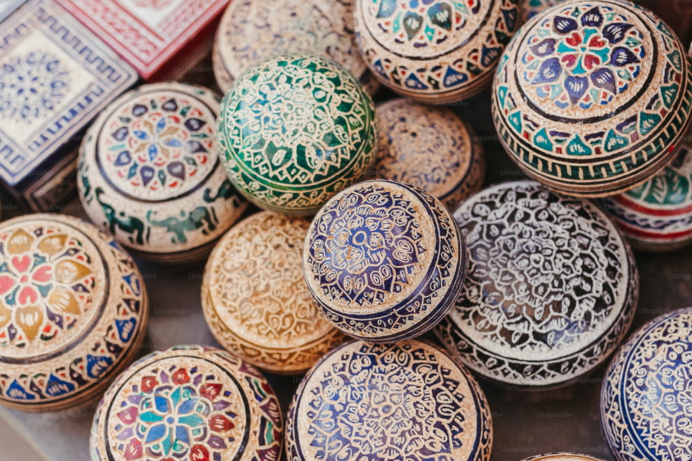a close up of a bunch of different colored bowls