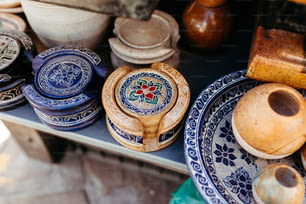 a table topped with blue and white plates and bowls