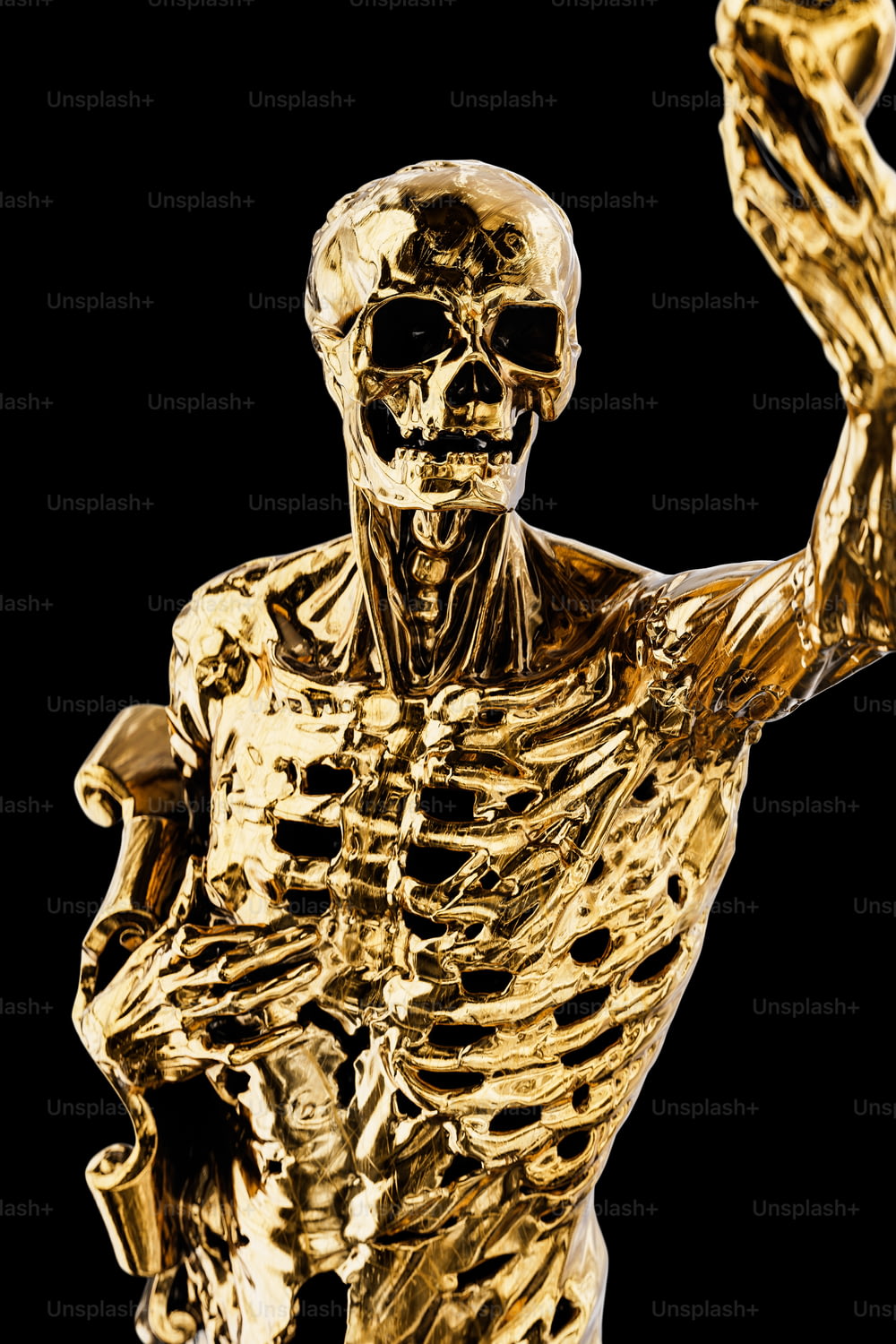 a gold statue of a skeleton holding a tennis racquet