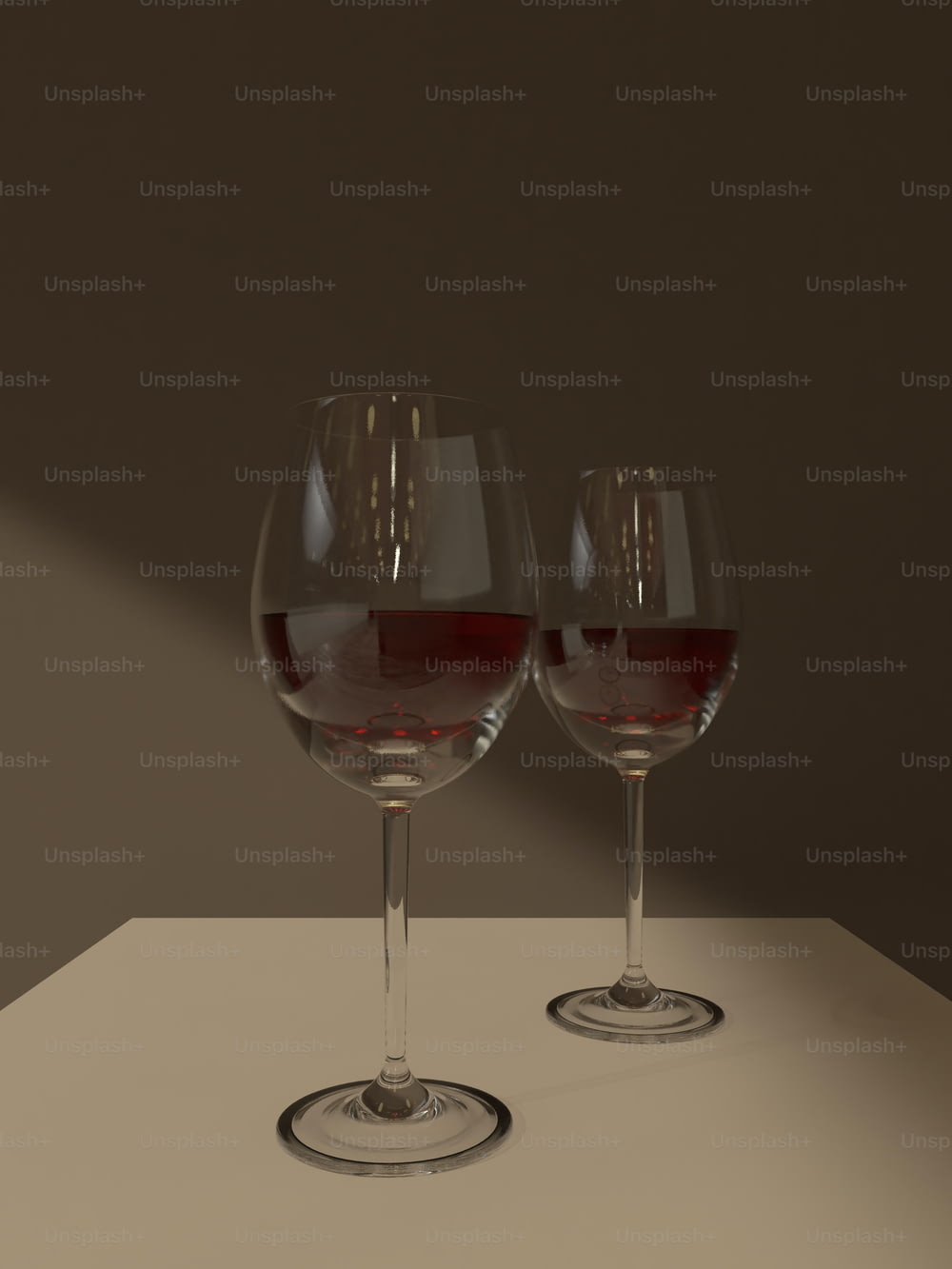 two glasses of wine sitting on a table