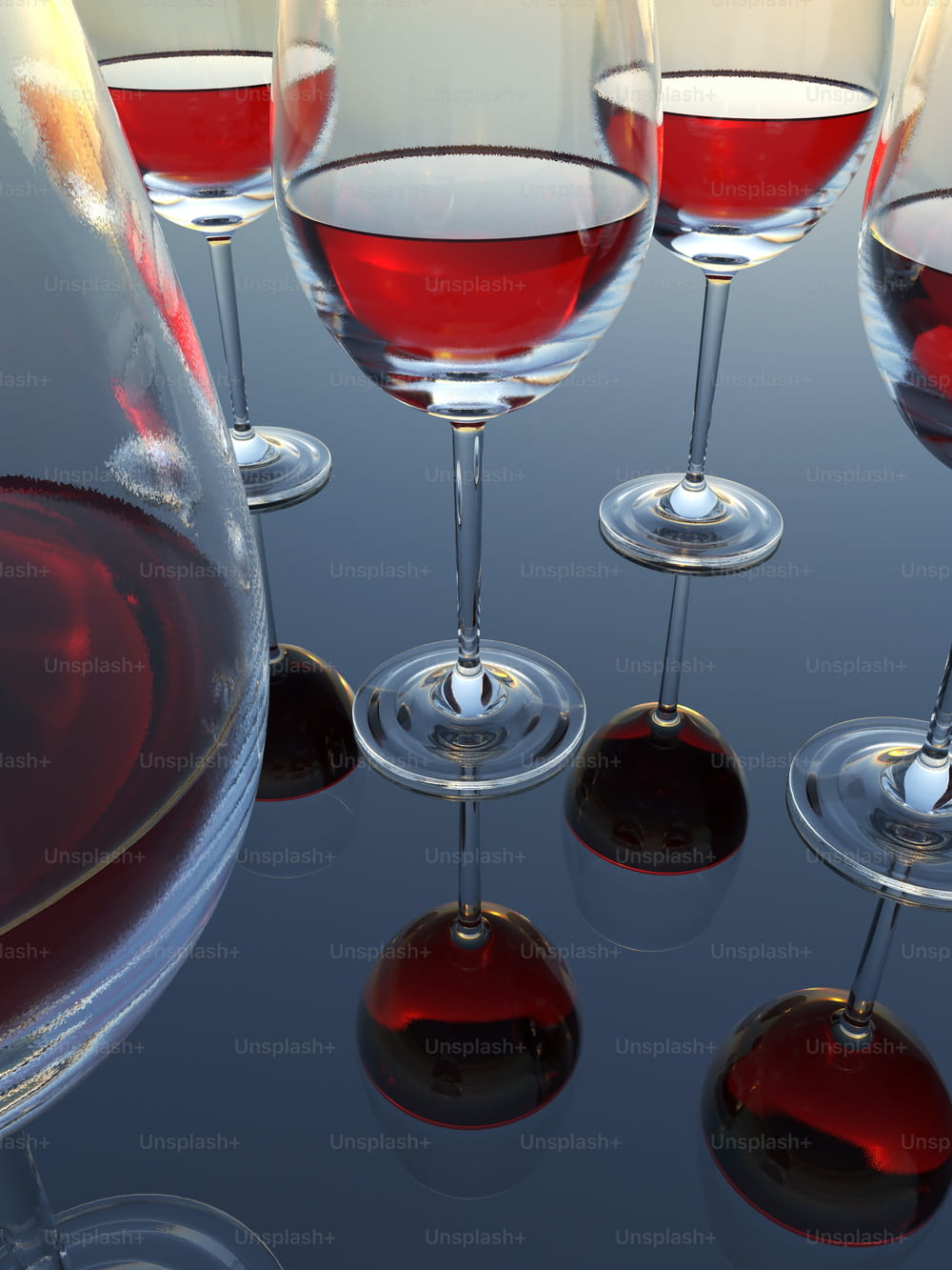 un groupe de verres à vin remplis de vin rouge