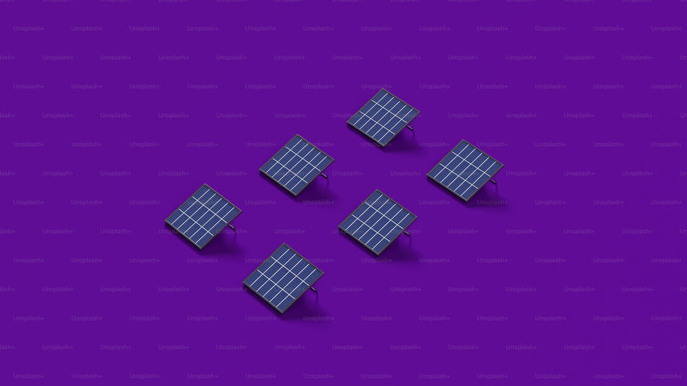 a group of four solar panels sitting on top of a purple surface