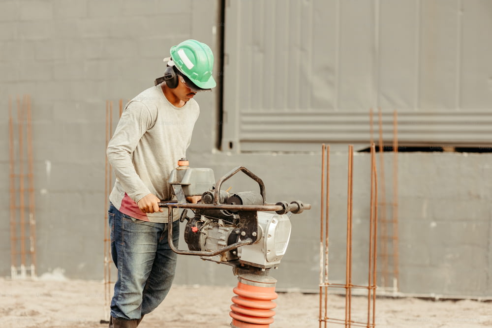 a man in a hard hat working on a construction site