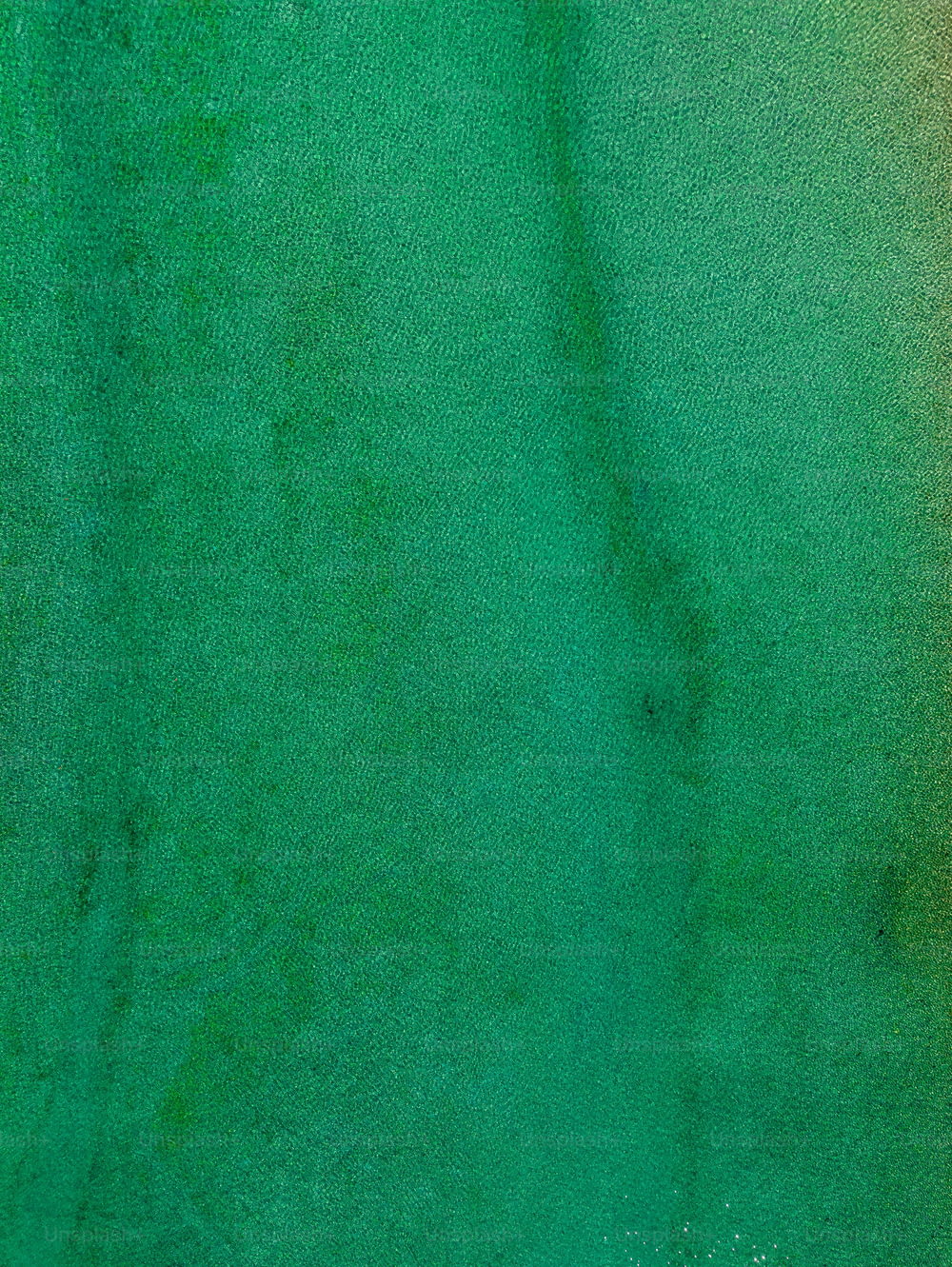 a close up of a green and yellow background