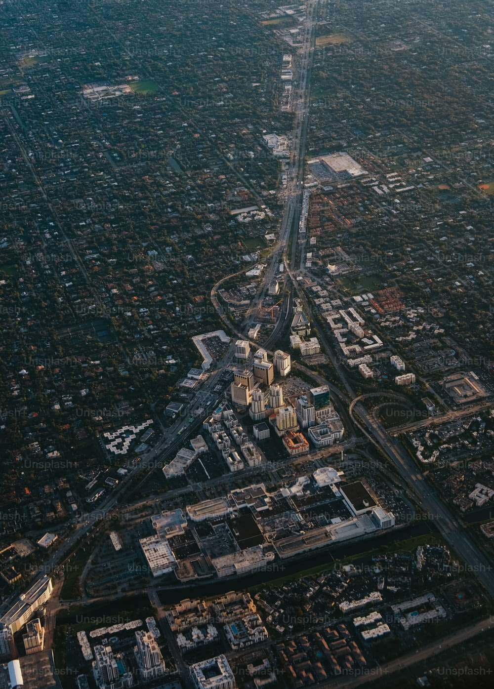an aerial view of a city with buildings and roads
