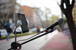a microphone with a cell phone attached to it