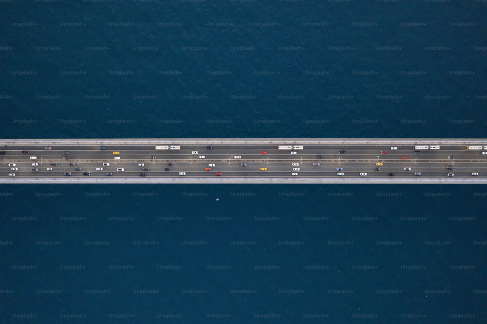 an aerial view of a highway in the middle of the ocean