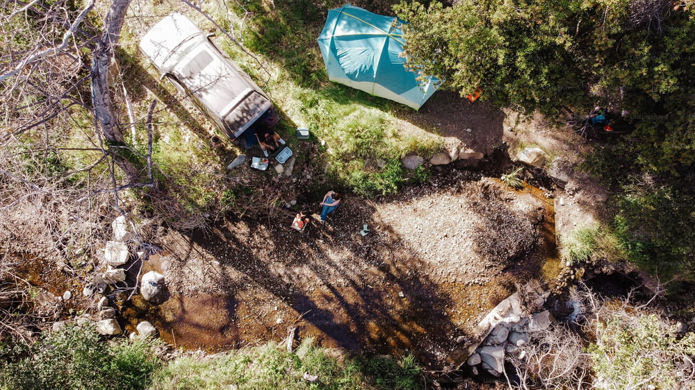 an aerial view of a group of people in the woods