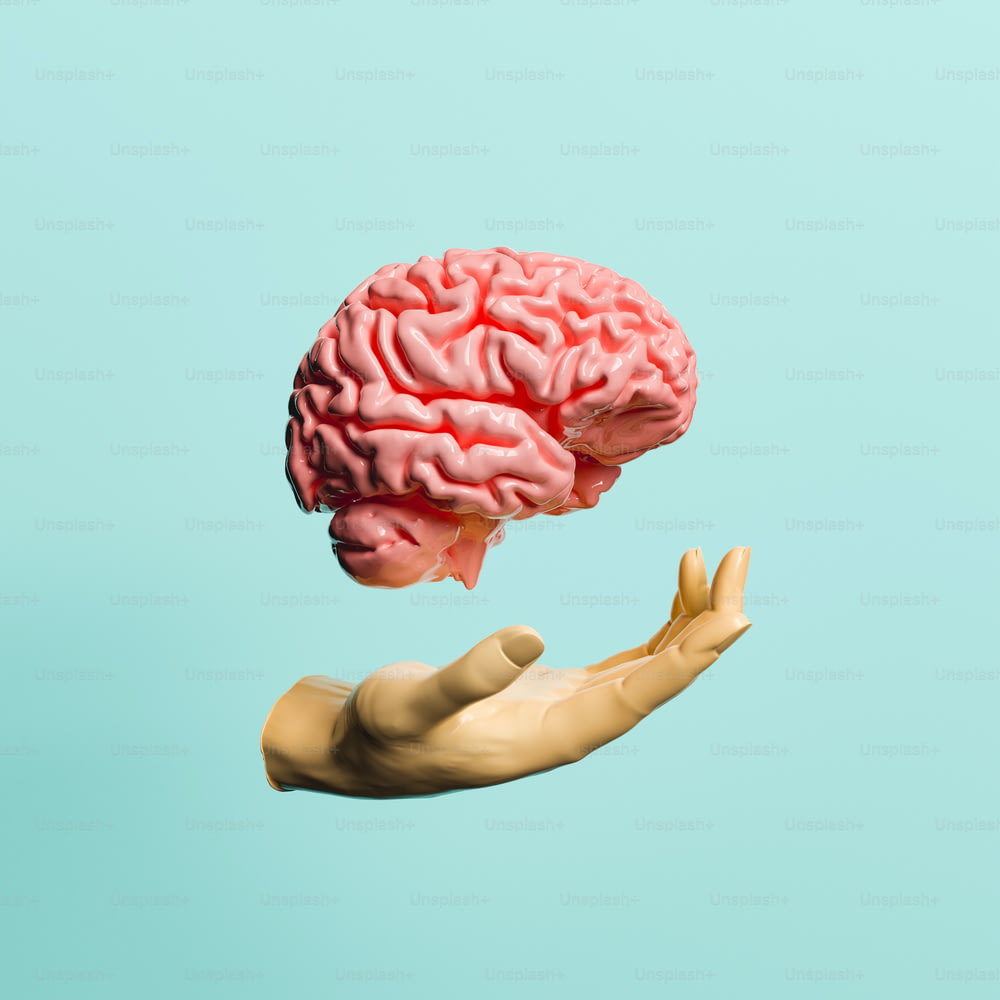 main avec un cerveau flottant au-dessus d’elle. concept d’apprentissage et de santé mentale. Rendu 3D