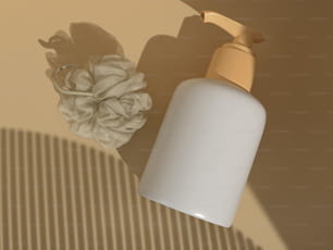a bottle of lotion sitting next to a flower