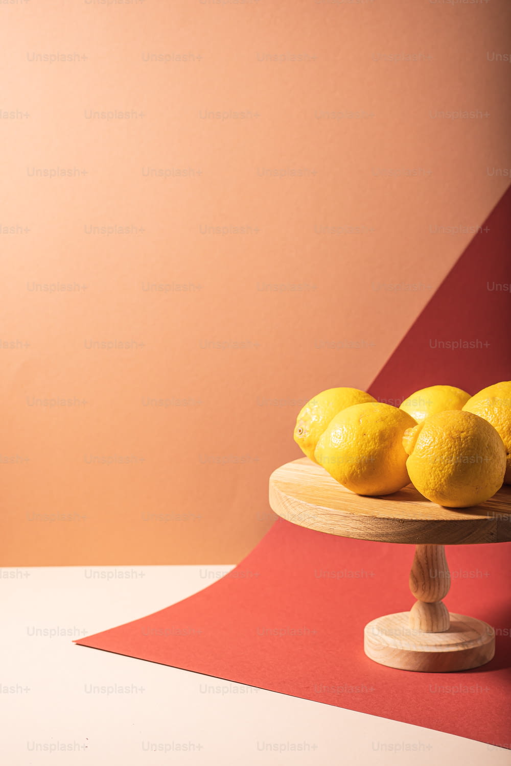 a bowl of lemons sitting on top of a table
