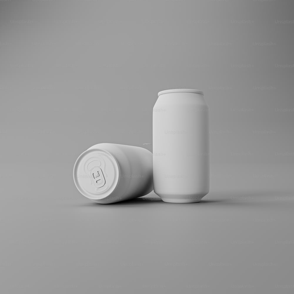 a white can and a white cup on a gray background
