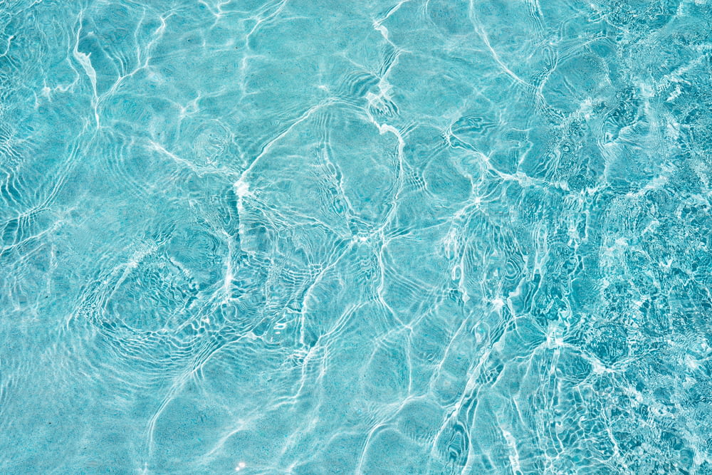 a blue pool with clear blue water