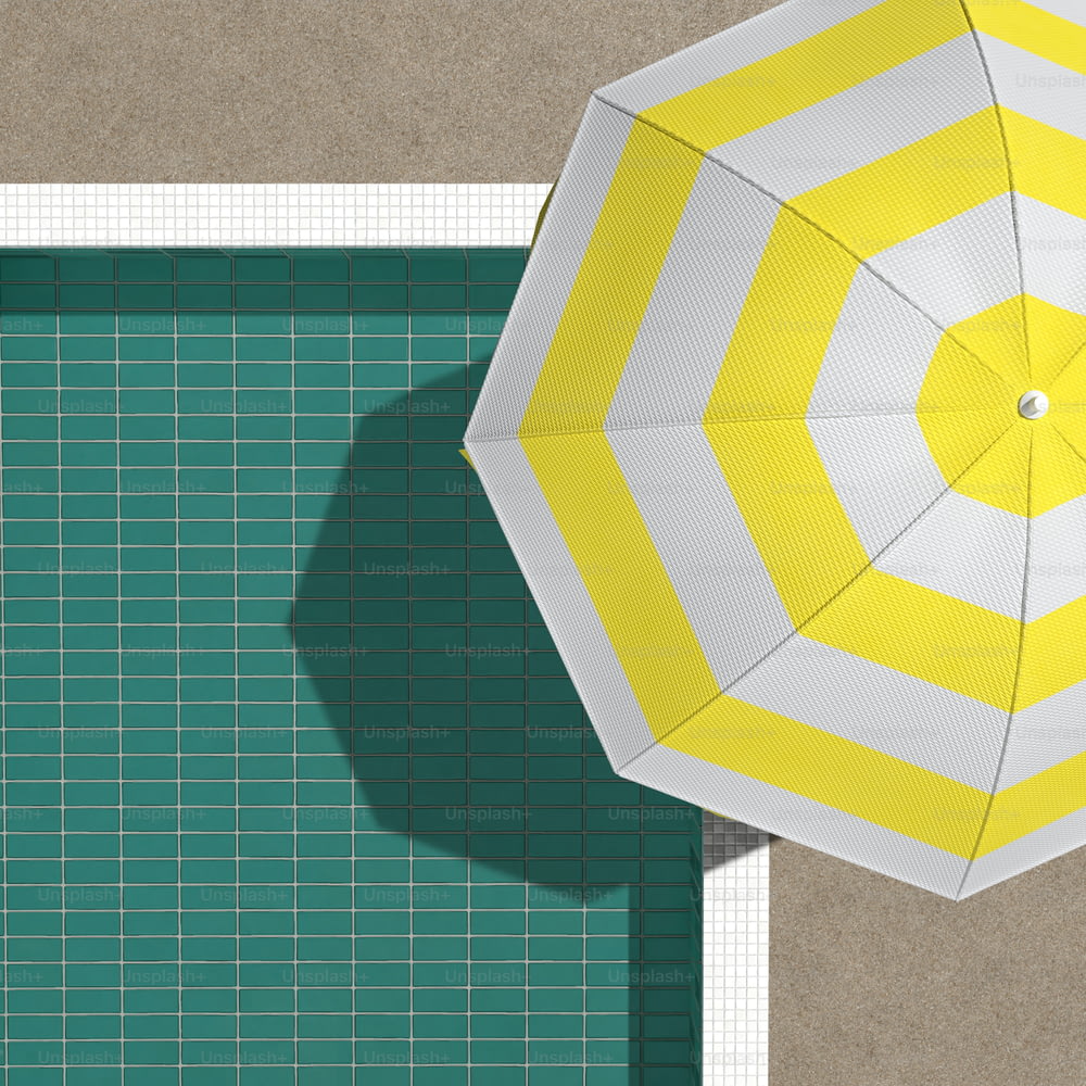 an overhead view of a yellow and white umbrella