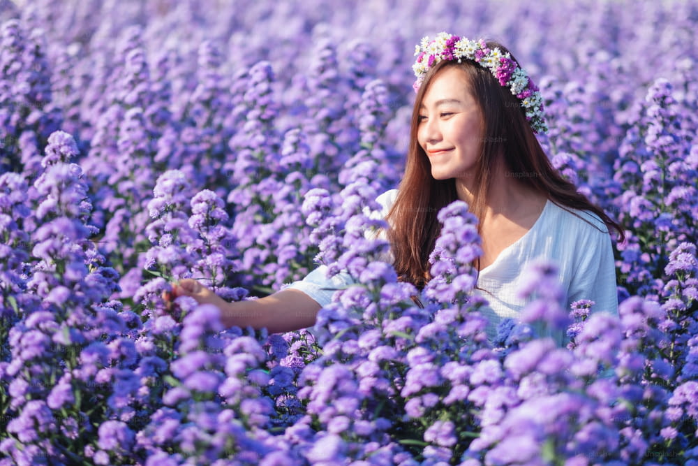 Portrait image of an asian woman in a beautiful Margaret flower field