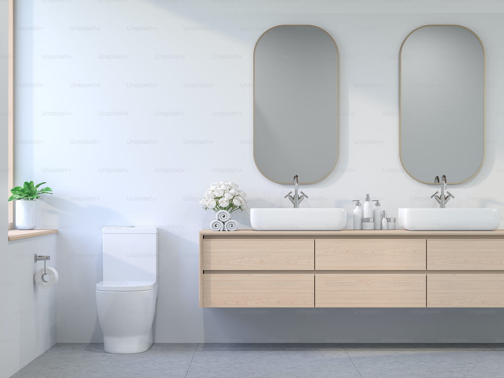 Minimales Badezimmer im zeitgenössischen Stil 3D-Rendering, Das Zimmer verfügt über weiße Wände und Betonfliesenböden, die mit Holzschränken und goldenen Glasrahmen verziert sind. Das Sonnenlicht dringt in den Raum ein.
