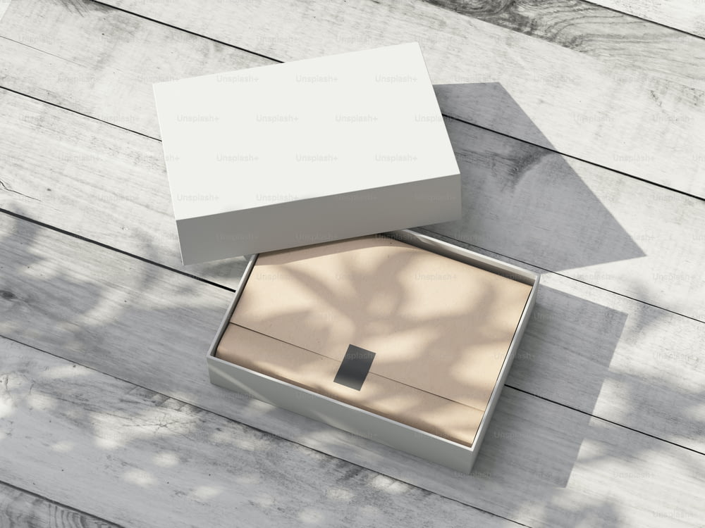Opened white carton Gift Box Mockup with kraft wrapping paper on the wooden table outdoor. 3d rendering