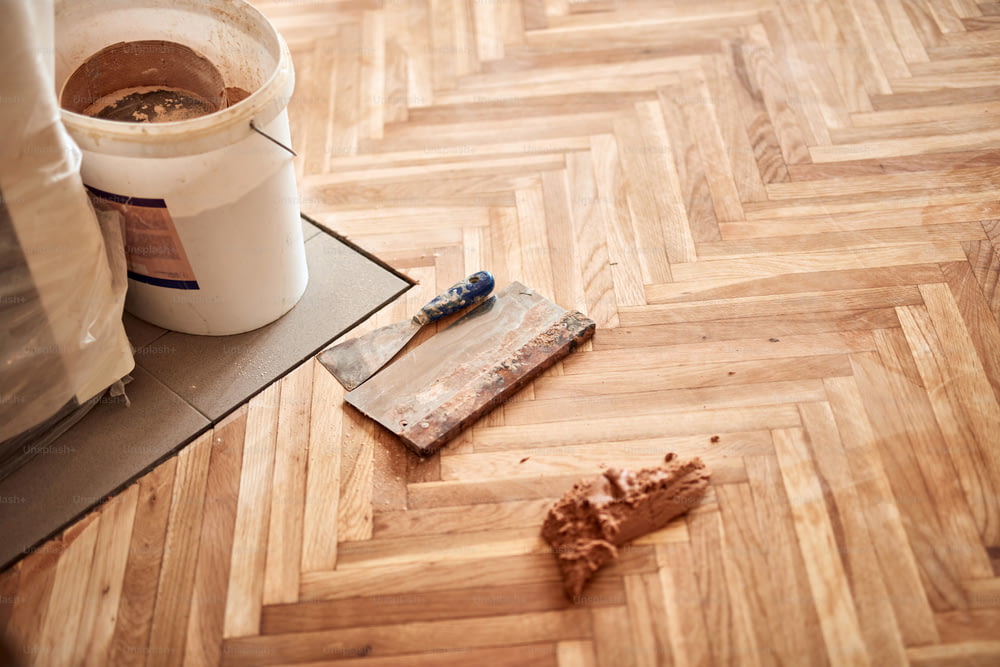 Restoring and cleaning old hardwood floor parquet.