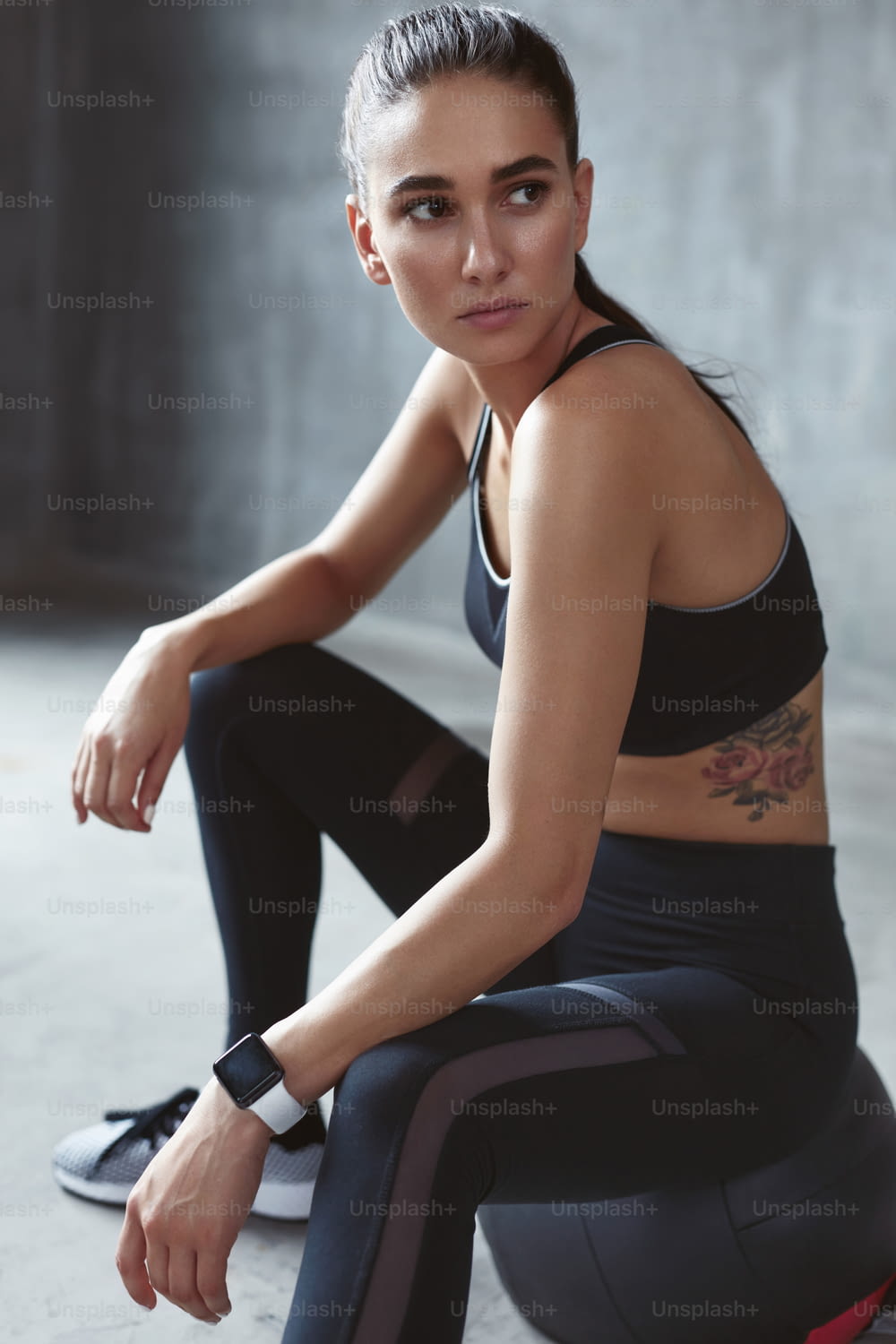 Fitness Woman In Fashion Sportswear Sitting On Med Ball After Sport Training Portrait. High Resolution