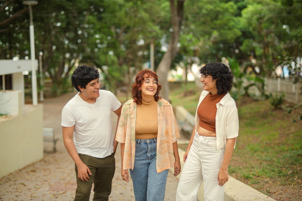 a group of three people standing next to each other