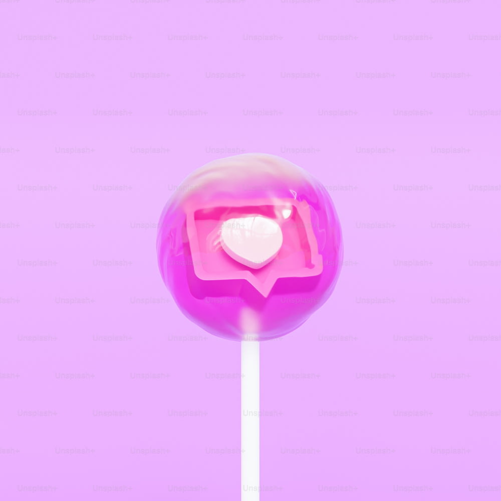 a pink lollipop with a heart on it