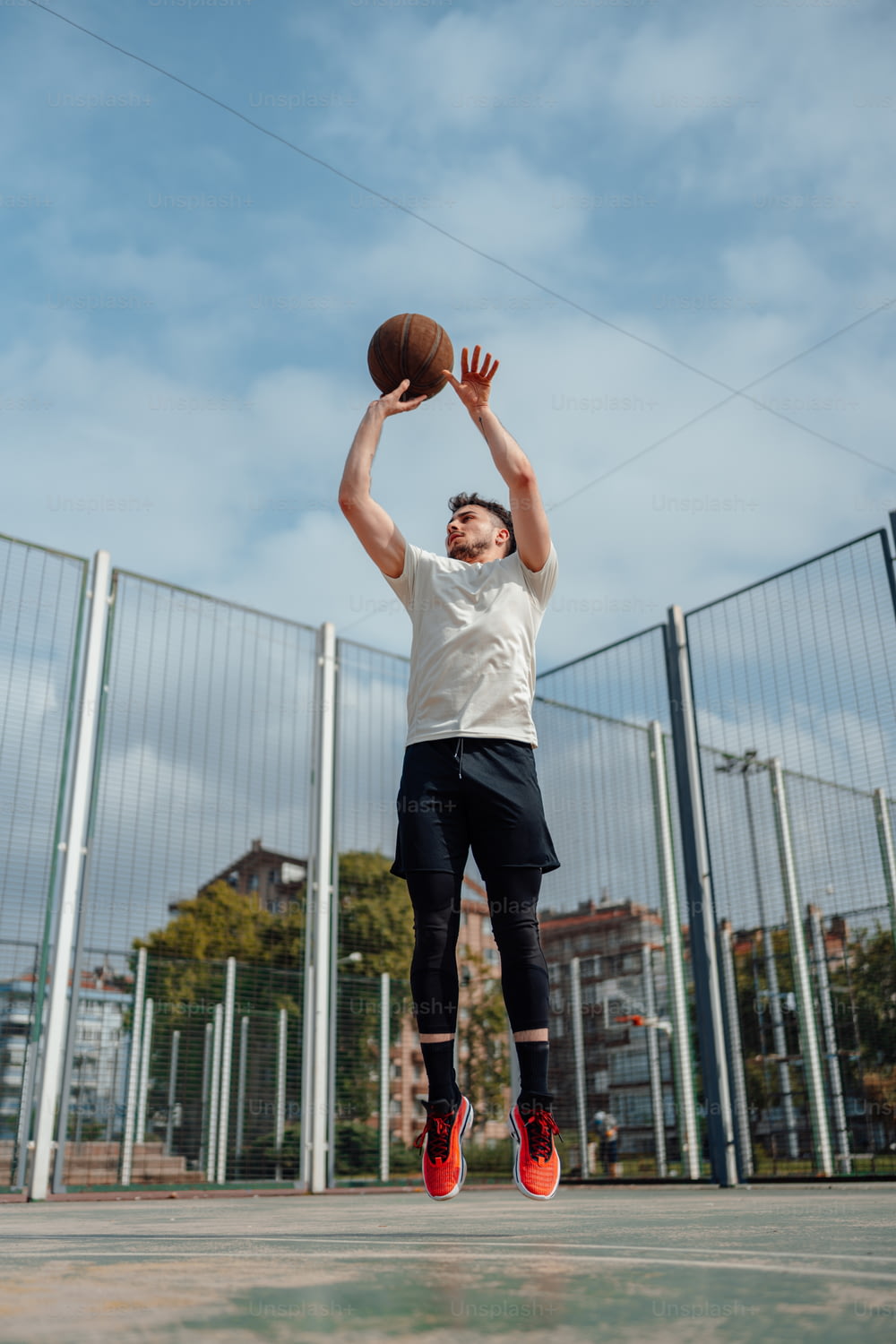 a man jumping up to dunk a basketball