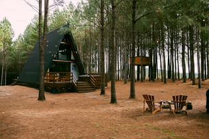 a tent set up in the middle of a forest