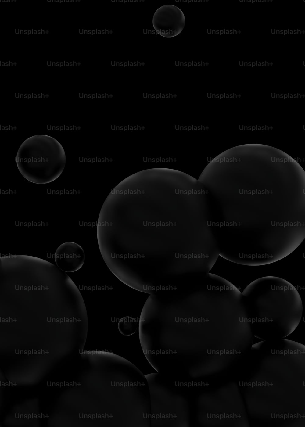 a bunch of black bubbles floating in the air