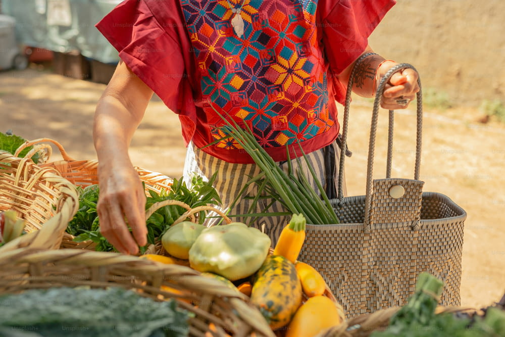 a woman standing next to a basket of vegetables