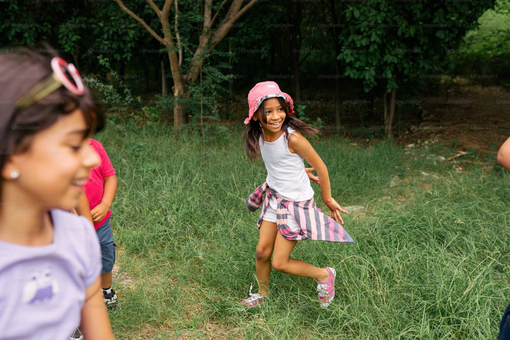 a group of young girls playing a game of frisbee