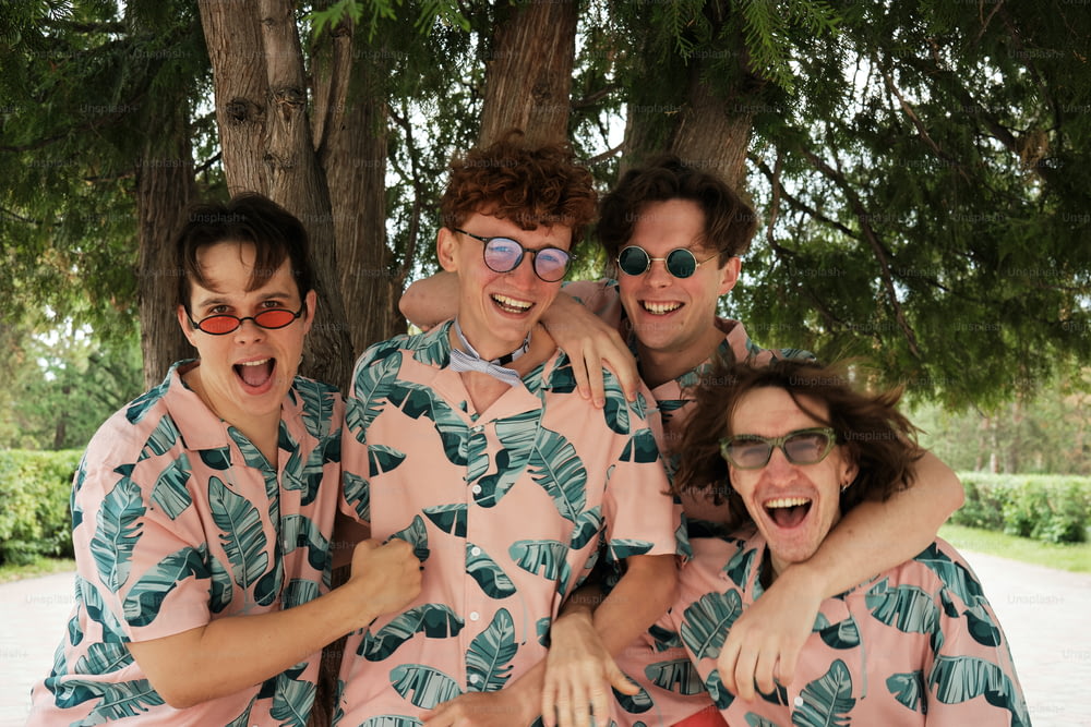 a group of men in matching pajamas posing for a picture