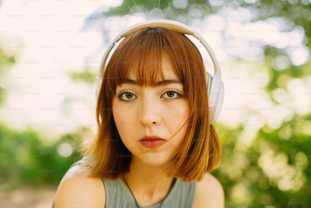 a woman with headphones on her ears