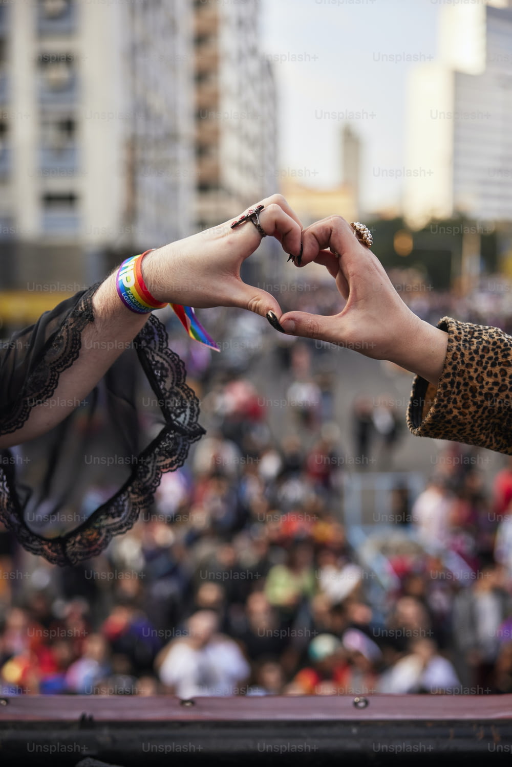 two people making a heart with their hands
